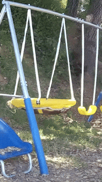 A Blue And Yellow Swing Set With A Yellow Swing In The Middle GIF