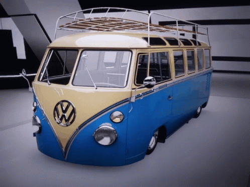 A Blue And Yellow Vw Van With A Roof Rack GIF