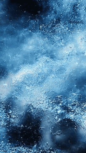 A Blue Background With A Lot Of Small Bubbles On It GIF