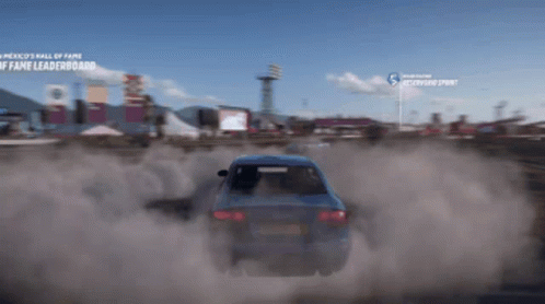 A Blue Car Is Driving Down A Dirt Road In Front Of A Sign That Says ' America 'S Wall Of Fame ' GIF