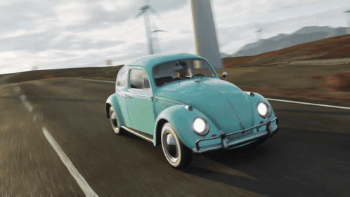 A Blue Car Is Driving Down A Road In Front Of A Windmill GIF