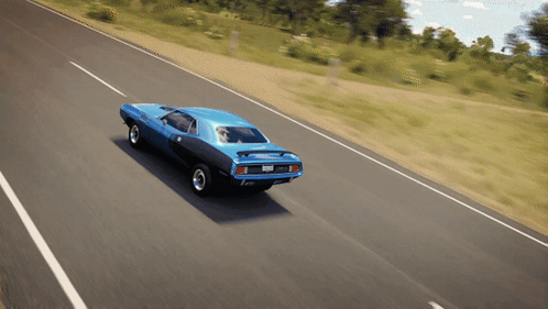A Blue Car Is Driving Down A Road With A License Plate That Says ' Jcl ' On It GIF