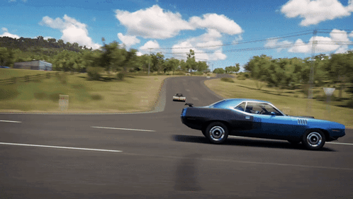 A Blue Car Is Driving Down A Road With Trees In The Background GIF