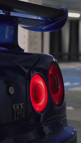 A Blue Car With A License Plate That Says Robo Hk9 GIF