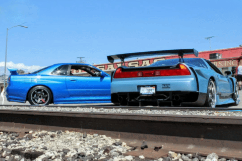 A Blue Car With A License Plate That Says ' Tc ' On It Is Parked Next To Another Car GIF