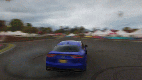 A Blue Car With A New York License Plate Is Driving On A Road GIF