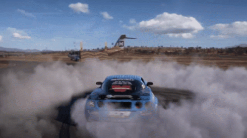 A Blue Car With A Sticker On The Back That Says ' Racing ' On It GIF