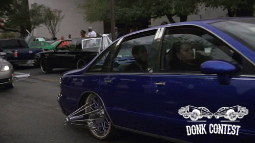 a blue car with a sticker that says donk contest on it