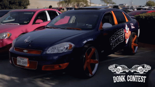 A Blue Car With Frosted Flakes On The Side Is Parked Next To A Pink Car GIF