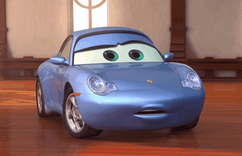 A Blue Cartoon Car With Green Eyes And A Surprised Look On Its Face GIF