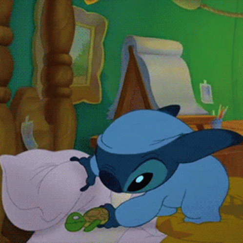 a blue cartoon character is holding a small green frog