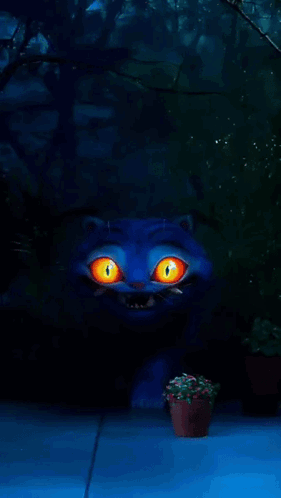 A Blue Cat With Orange Eyes And Sharp Teeth Stands In A Dark Forest GIF