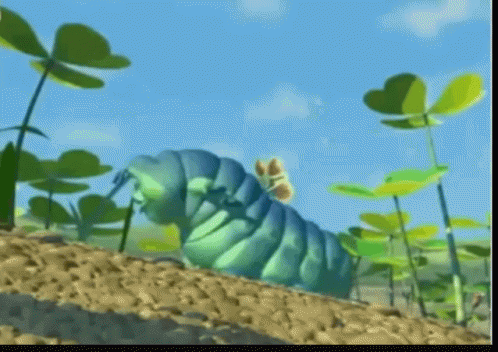 A Blue Caterpillar With A Butterfly On Its Back Is Crawling Through A Field Of Plants GIF