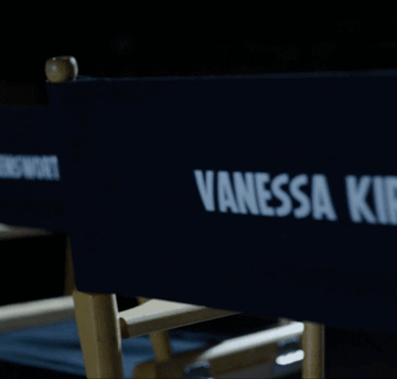 A Blue Director 'S Chair With Vanessa Kirby Written On It GIF