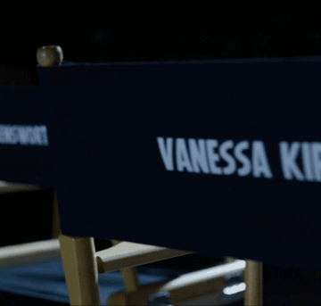 A Blue Director 'S Chair With Vanessa Kirby Written On It GIF