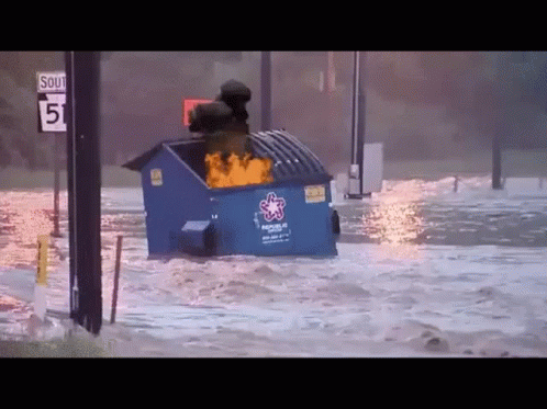 A Blue Dumpster With The Word Rescue On It Is Floating In The Water GIF
