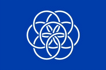 a blue flag with a white flower on it .