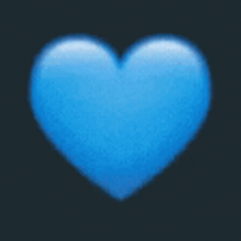 A Blue Heart On A Black Background Is A Blurred Image GIF
