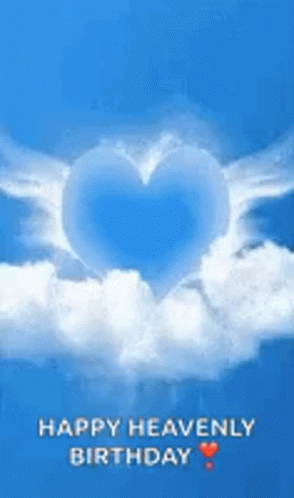 A Blue Heart With White Wings Is Floating In The Sky . GIF