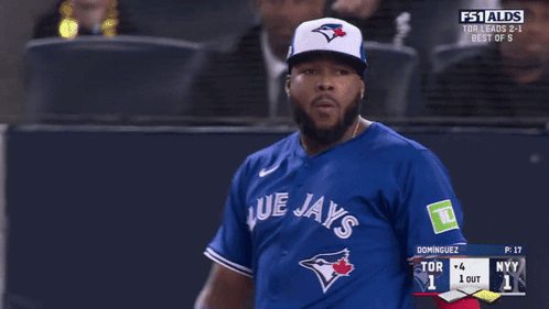 A Blue Jays Baseball Player Is Looking At Another Player GIF
