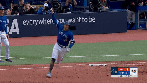 A Blue Jays Player Runs To First Base GIF