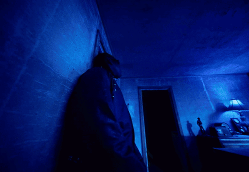 A Blue Light Is Shining On A Dark Blue Background GIF