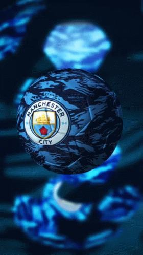 A Blue Manchester City Soccer Ball With A Ship On It GIF