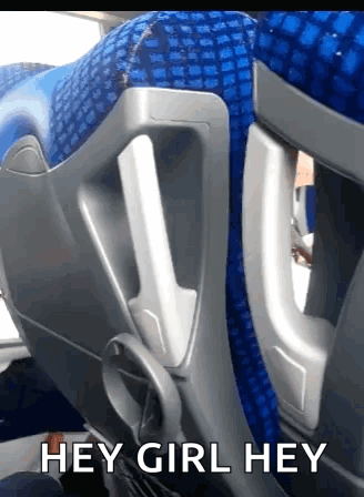 A Blue Seat On A Bus With The Words Hey Girl Hey GIF