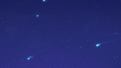 A Blue Sky With A Few Shooting Stars In It GIF