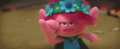 A Blue Stuffed Animal And A Pink Stuffed Animal Are Standing Next To Each Other In A Field . GIF