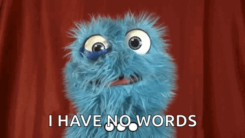 A Blue Stuffed Animal With Big Eyes Is Saying I Have No Words . GIF
