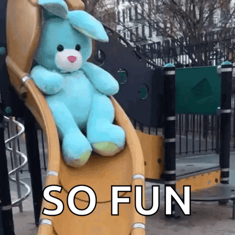 a blue stuffed bunny sits on a slide with the words so fun below it