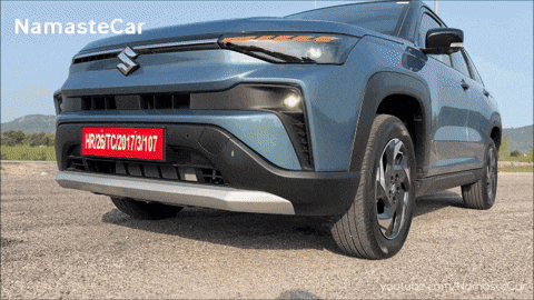 A Blue Suzuki Car With A License Plate That Says Hr26tc20173107 GIF