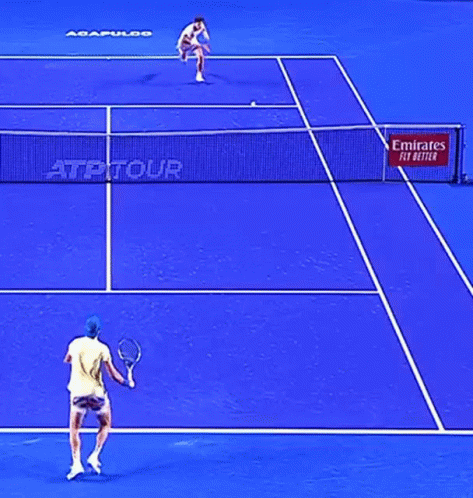 A Blue Tennis Court With A Emirates Fly Better Sign GIF