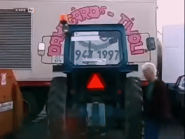 Blue Tractor Parked In Front Of Cards Til You Sign GIF