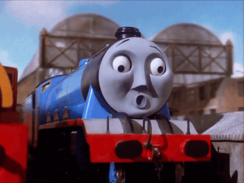 A Blue Train With A Surprised Face On It GIF