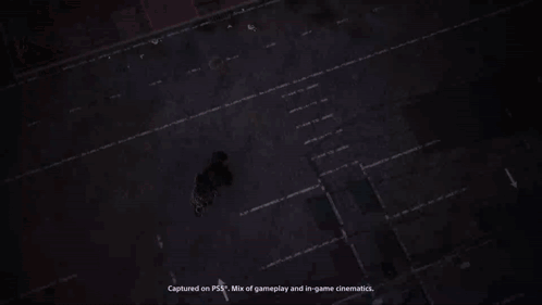 A Blue Van Is Parked In Front Of A Wall That Has The Word Entrance Painted On It GIF