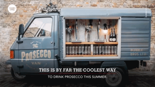 A Blue Van That Says The Prosecco Van On It GIF
