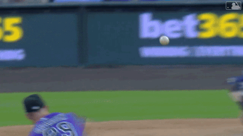 a blurred image of a baseball field with a bet365 sign in the background