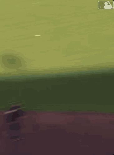 A Blurred Image Of A Baseball Field With The Mlb Logo GIF