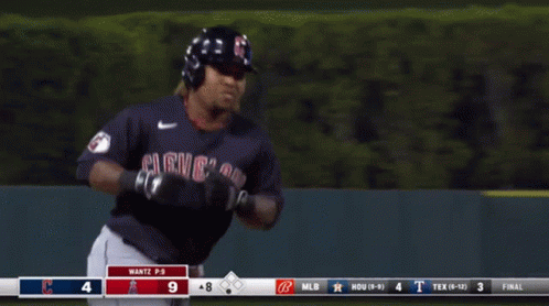 a blurred image of a baseball player with the number 18 on his jersey