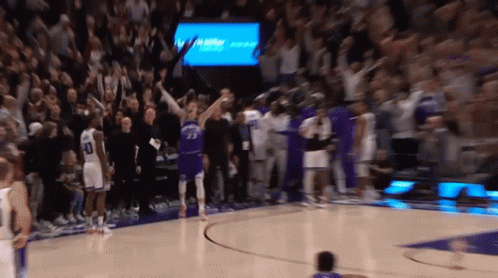 A Blurred Image Of A Basketball Game With A Player Wearing Number 23 GIF