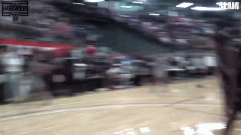 A Blurred Image Of A Basketball Game With The Words Slam On The Bottom GIF