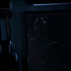 A Blurred Image Of A Blue Wall With A Clock On It GIF