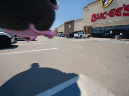A Blurred Image Of A Buck Ee 'S Store GIF