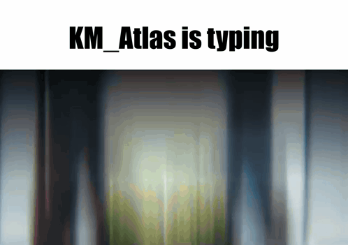 Blurred Building Image With K.M. Atlas Typing GIF
