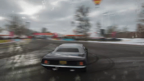 A Blurred Image Of A Car Driving Down A Road GIF
