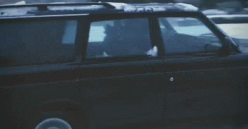 a blurred image of a car driving down a street