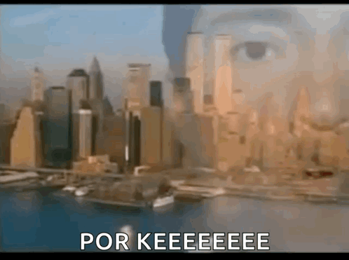 a blurred image of a city with the words por keeeeeee written in the corner