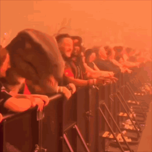 A Blurred Image Of A Crowd Of People Watching A Concert GIF